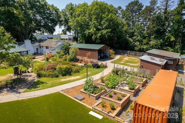 9032 Boyd Dr, Matthews, NC 28105 - view of yard featuring a vegetable garden and an outdoor structure