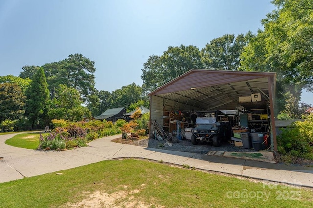 9032 Boyd Dr, Matthews, NC 28105 - view of parking / parking lot featuring a detached carport and driveway