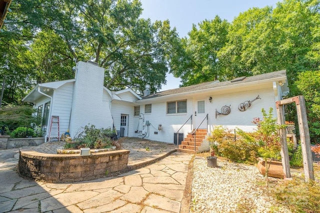 9032 Boyd Dr, Matthews, NC 28105 - back of property with a chimney and brick siding