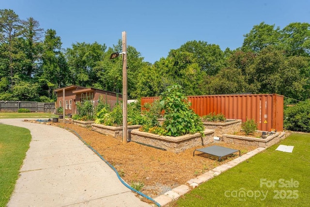 9032 Boyd Dr, Matthews, NC 28105 - view of yard with a vegetable garden, view of scattered trees, and an outdoor structure