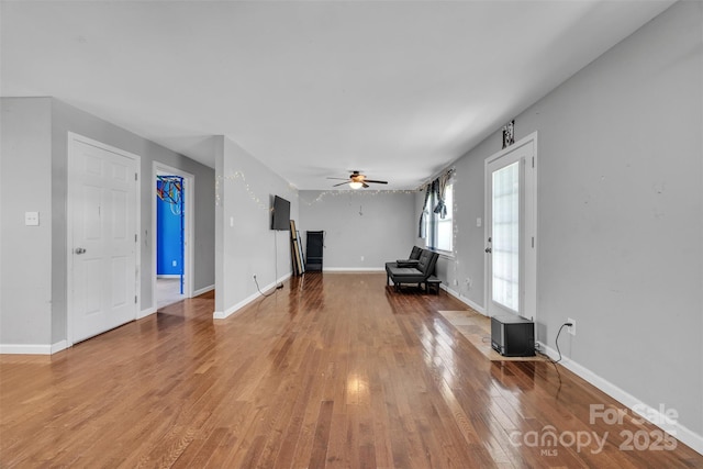 369 Birch Circle Dr, Hudson, NC 28638 - unfurnished living room with a ceiling fan and wood finished floors
