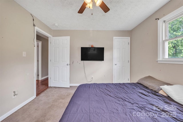 369 Birch Circle Dr, Hudson, NC 28638 - bedroom with carpet flooring, a textured ceiling, and ceiling fan