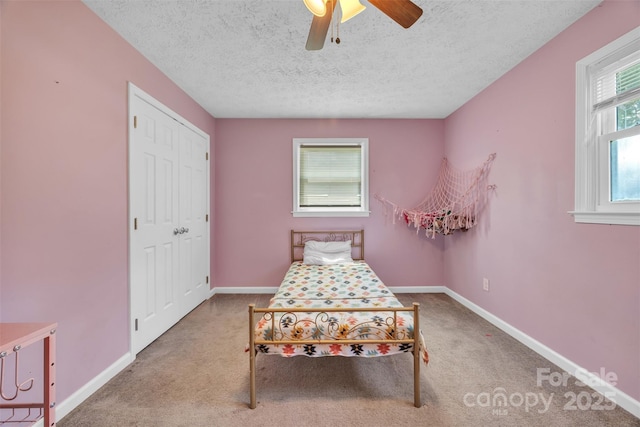 369 Birch Circle Dr, Hudson, NC 28638 - carpeted bedroom featuring a textured ceiling, a ceiling fan, and a closet