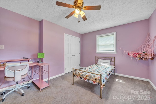 369 Birch Circle Dr, Hudson, NC 28638 - carpeted bedroom featuring a textured ceiling, a closet, and a ceiling fan