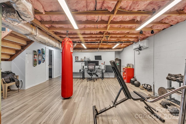 369 Birch Circle Dr, Hudson, NC 28638 - workout room with a wall mounted air conditioner and light wood-style flooring