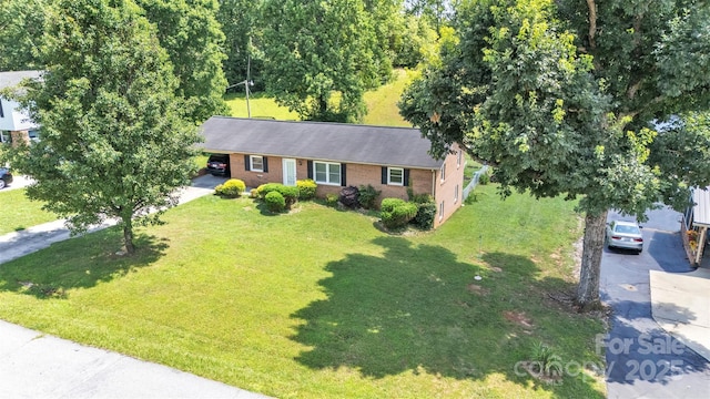 369 Birch Circle Dr, Hudson, NC 28638 - ranch-style home featuring concrete driveway, brick siding, a front yard, and a carport