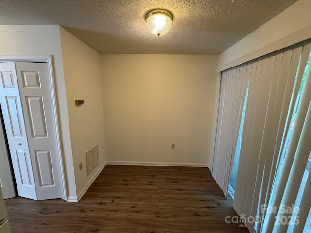 972 NW 8th Ave, Hickory, NC 28601 - spare room featuring dark wood-type flooring and a textured ceiling