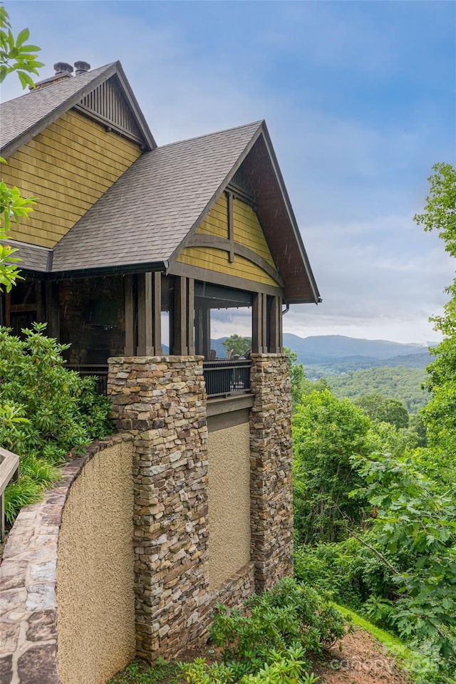 14 Clear Fork Ln, Fairview, NC 28730 - view of side of property featuring roof with shingles, board and batten siding, and stone siding