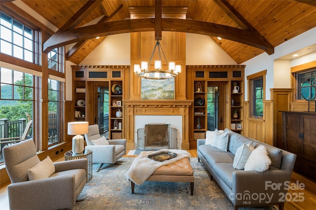14 Clear Fork Ln, Fairview, NC 28730 - living area featuring high vaulted ceiling, a wood ceiling with exposed beams, a chandelier, a fireplace with flush hearth, and wood finished floors