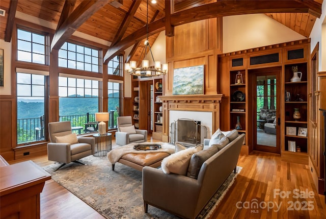 14 Clear Fork Ln, Fairview, NC 28730 - living area with a wooden ceiling with exposed beams, high vaulted ceiling, a fireplace, a chandelier, and light wood-style floors