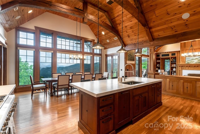 14 Clear Fork Ln, Fairview, NC 28730 - kitchen featuring a chandelier, a wooden ceiling with exposed beams, light countertops, light wood finished floors, and high vaulted ceiling