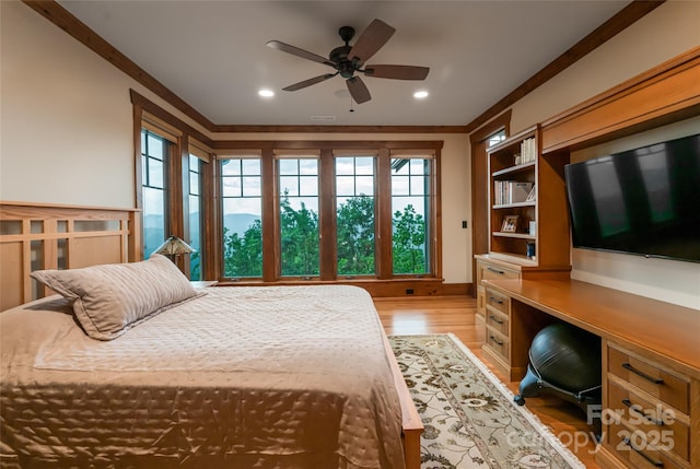 14 Clear Fork Ln, Fairview, NC 28730 - bedroom featuring light wood-style flooring, recessed lighting, built in desk, and ornamental molding