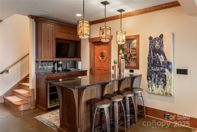 14 Clear Fork Ln, Fairview, NC 28730 - indoor bar featuring stairs, decorative light fixtures, recessed lighting, finished concrete flooring, and crown molding