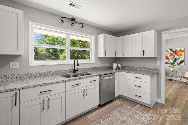 6672 Brevard Rd, Etowah, NC 28729 - kitchen with dishwasher, plenty of natural light, white cabinetry, and light wood finished floors