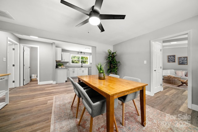 6672 Brevard Rd, Etowah, NC 28729 - dining room with a ceiling fan and light wood-type flooring