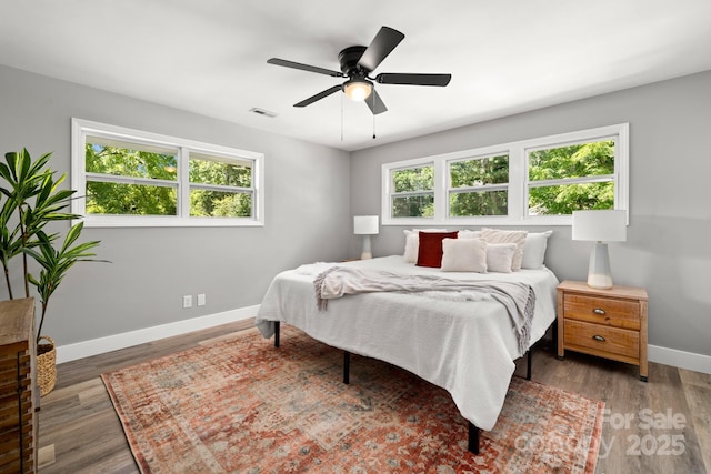 6672 Brevard Rd, Etowah, NC 28729 - bedroom featuring wood finished floors and ceiling fan