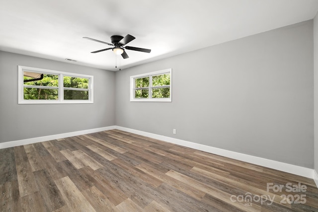 6672 Brevard Rd, Etowah, NC 28729 - unfurnished room featuring wood finished floors and ceiling fan