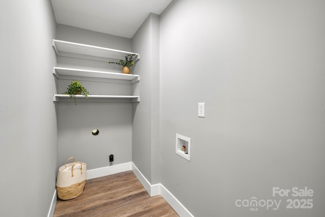6672 Brevard Rd, Etowah, NC 28729 - washroom featuring hookup for a washing machine and wood finished floors