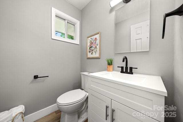 6672 Brevard Rd, Etowah, NC 28729 - half bathroom with vanity and wood finished floors