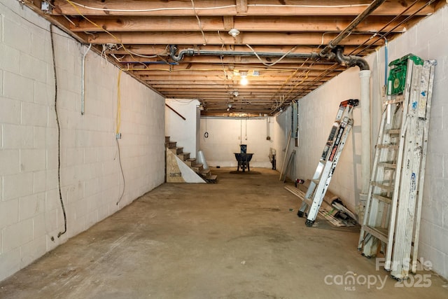 6672 Brevard Rd, Etowah, NC 28729 - unfinished basement featuring concrete block wall and stairs