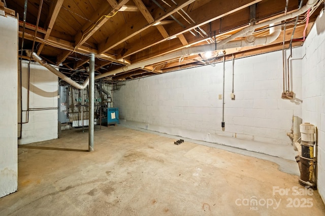 6672 Brevard Rd, Etowah, NC 28729 - unfinished basement featuring gas water heater and concrete block wall