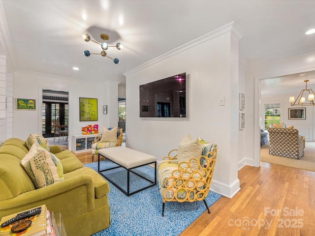 2912 Wheelock Rd, Charlotte, NC 28211 - living area featuring a chandelier, light wood-type flooring, ornamental molding, and recessed lighting