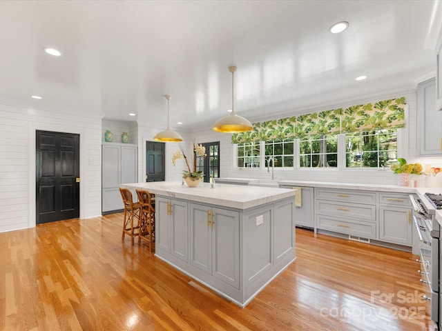 2912 Wheelock Rd, Charlotte, NC 28211 - kitchen featuring plenty of natural light, a center island, range with two ovens, light wood-style flooring, and recessed lighting