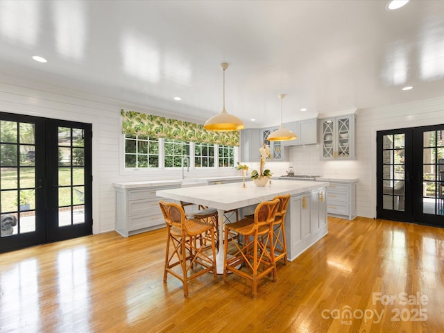2912 Wheelock Rd, Charlotte, NC 28211 - kitchen featuring french doors, light countertops, healthy amount of natural light, recessed lighting, and light wood-type flooring