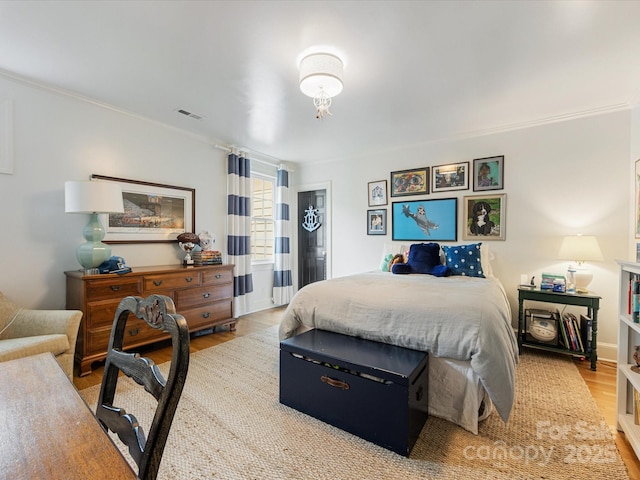 2912 Wheelock Rd, Charlotte, NC 28211 - bedroom featuring wood finished floors and crown molding