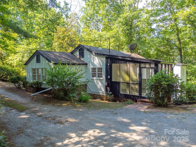 197 Briar Patch Rd, Cullowhee, NC 28723 - view of front of property with roof with shingles and a sunroom