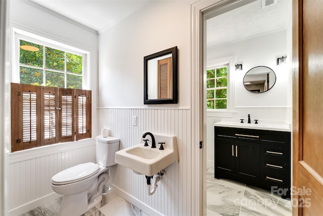 197 Briar Patch Rd, Cullowhee, NC 28723 - bathroom with wainscoting, marble finish flooring, and ornamental molding