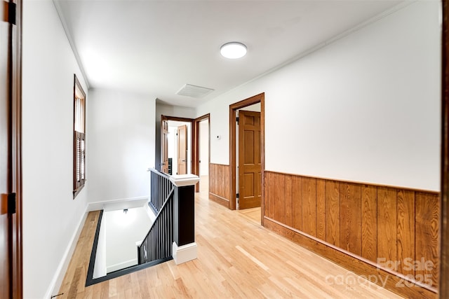 197 Briar Patch Rd, Cullowhee, NC 28723 - corridor featuring wainscoting, light wood finished floors, an upstairs landing, and wood walls