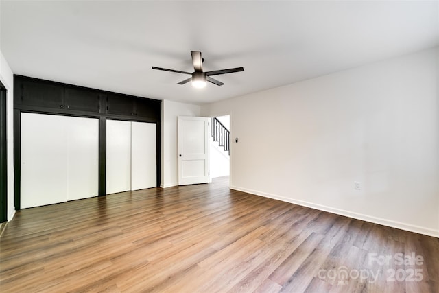 197 Briar Patch Rd, Cullowhee, NC 28723 - unfurnished bedroom featuring wood finished floors and ceiling fan