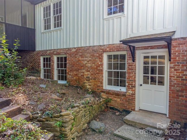 197 Briar Patch Rd, Cullowhee, NC 28723 - property entrance with board and batten siding and brick siding