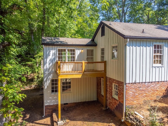 197 Briar Patch Rd, Cullowhee, NC 28723 - back of house featuring a shingled roof, board and batten siding, and brick siding