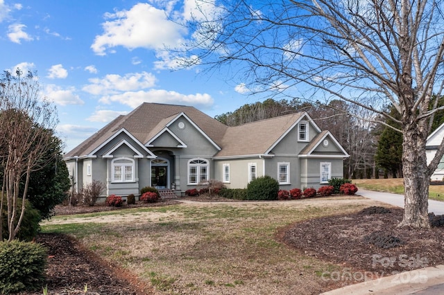 543 Muirfield Way, Salisbury, NC 28144 - view of front facade featuring stucco siding and a front lawn