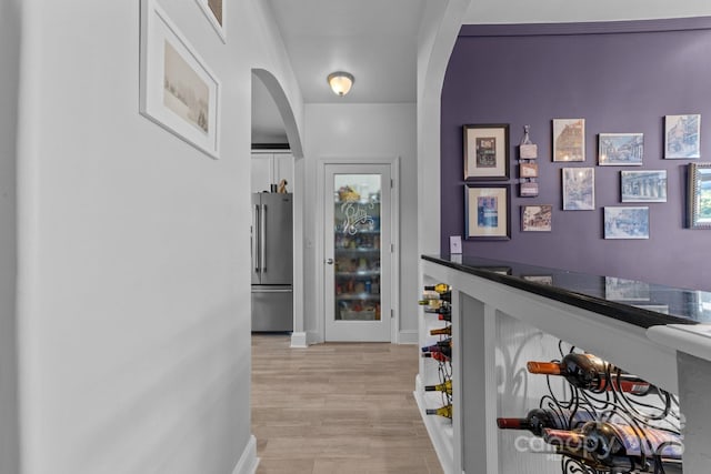 543 Muirfield Way, Salisbury, NC 28144 - hallway featuring arched walkways and light wood finished floors