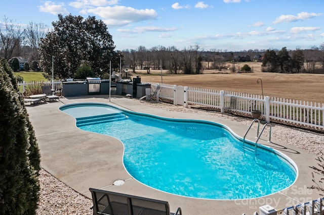 543 Muirfield Way, Salisbury, NC 28144 - view of pool featuring a patio area, a fenced backyard, and an outdoor kitchen