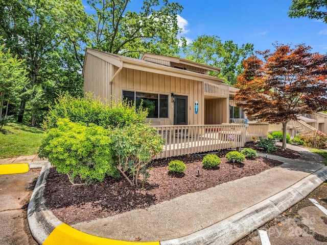 140 W Lake Dr Unit 301, Lake Lure, NC 28746 - view of front of home featuring board and batten siding and a wooden deck