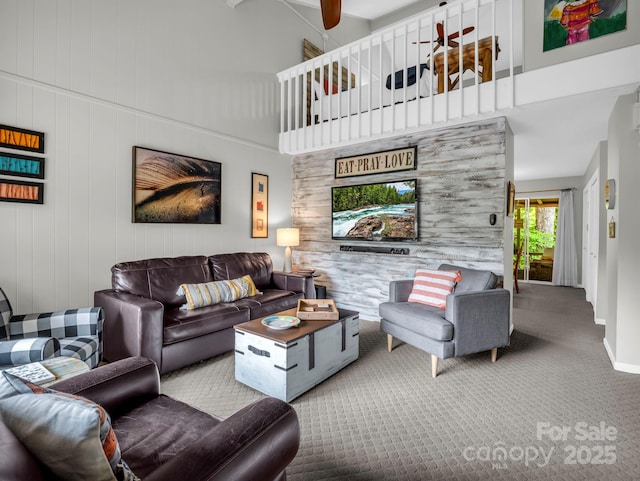 140 W Lake Dr Unit 301, Lake Lure, NC 28746 - living room with carpet floors, a high ceiling, and ceiling fan