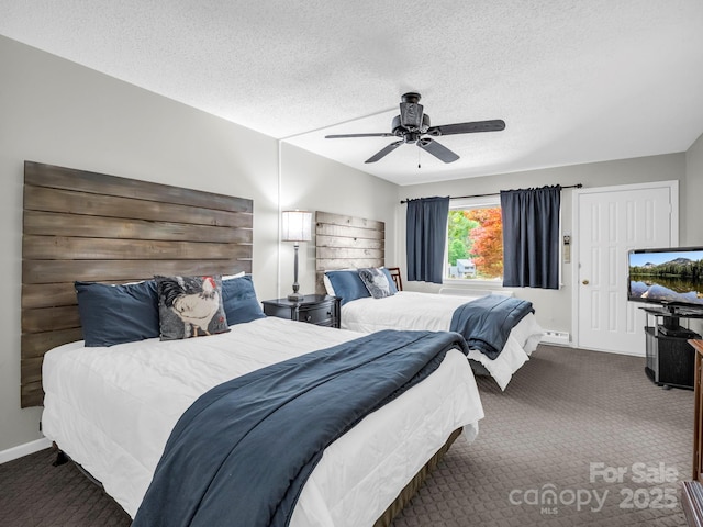 140 W Lake Dr Unit 301, Lake Lure, NC 28746 - carpeted bedroom featuring a textured ceiling and a ceiling fan