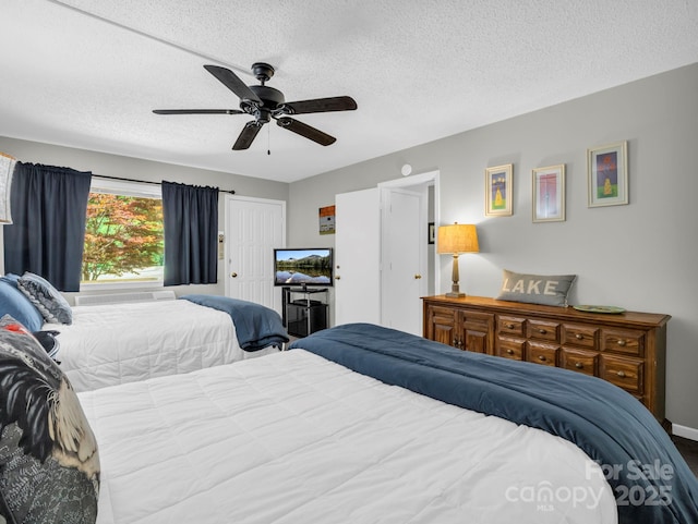 140 W Lake Dr Unit 301, Lake Lure, NC 28746 - bedroom with a textured ceiling and ceiling fan