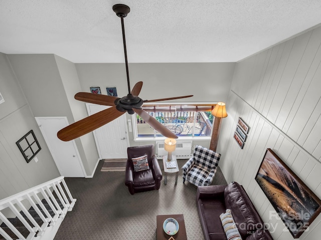 140 W Lake Dr Unit 301, Lake Lure, NC 28746 - living area with carpet flooring, ceiling fan, a textured ceiling, and a wall mounted air conditioner