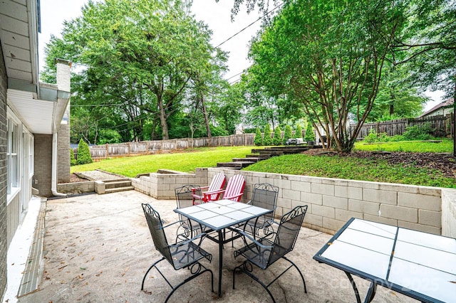 122 15th Ave NW, Hickory, NC 28601 - fenced backyard featuring a patio and outdoor dining area
