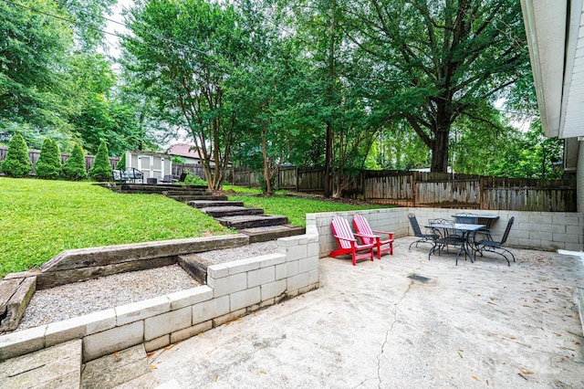 122 15th Ave NW, Hickory, NC 28601 - fenced backyard with a patio area and outdoor dining area
