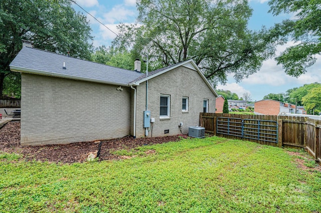 122 15th Ave NW, Hickory, NC 28601 - rear view of house featuring a chimney, a fenced backyard, and brick siding
