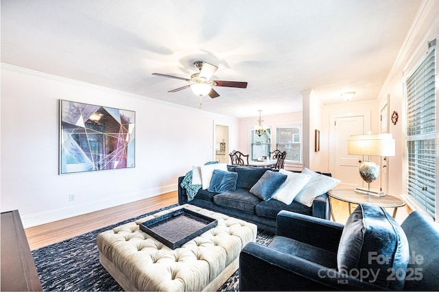 122 15th Ave NW, Hickory, NC 28601 - living room featuring wood finished floors, a chandelier, ceiling fan, healthy amount of natural light, and crown molding
