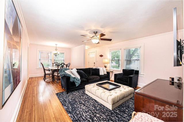 122 15th Ave NW, Hickory, NC 28601 - living room featuring light wood-style flooring, a chandelier, crown molding, and a ceiling fan