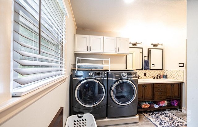 122 15th Ave NW, Hickory, NC 28601 - laundry room with washing machine and dryer, cabinet space, and crown molding