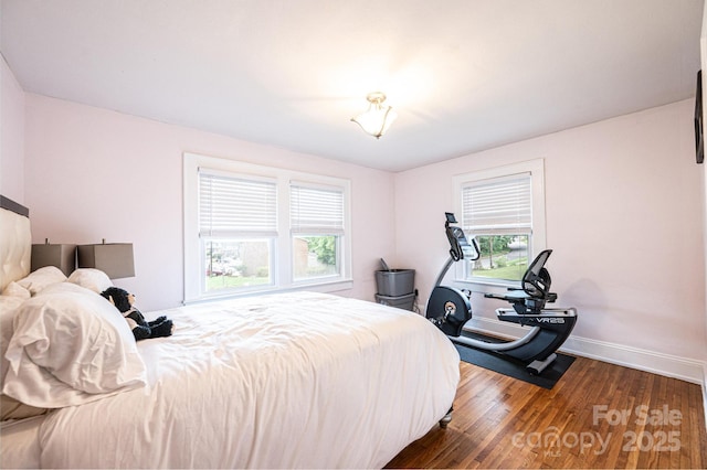 122 15th Ave NW, Hickory, NC 28601 - bedroom featuring multiple windows and wood finished floors